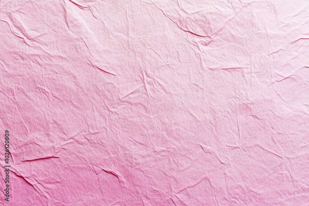 Fototapeta premium Close-up of wrinkled pink paper with a subtle gradient effect. 