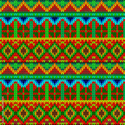 This image appears to be a brightly colored, intricate geometric pattern resembling traditional woven or knitted textiles. It features repeating motifs of diamonds, zigzags, and other angular shapes 