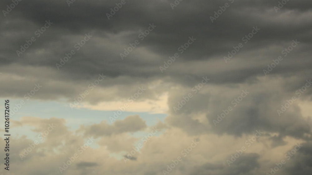 Fototapeta premium A breathtaking view of towering cumulus clouds Thunderous dark sky with black clouds 