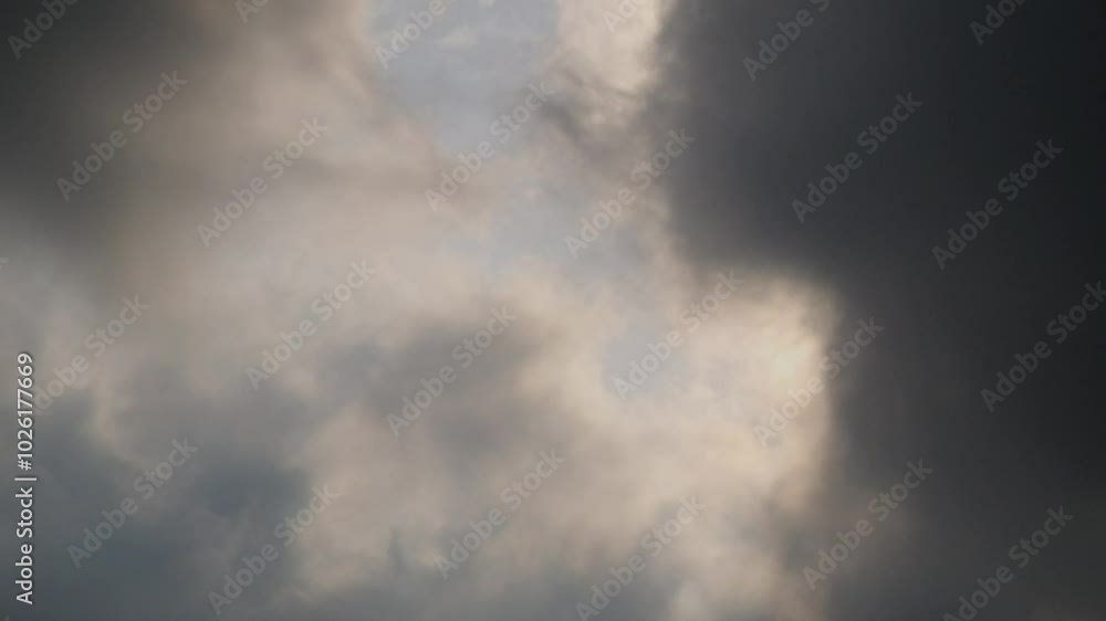 Timelapse of dramatic movement of dark clouds covering the sky. Rapid movement of clouds in the daytime sky. 4K, 60Fps footage can be used for slow motion