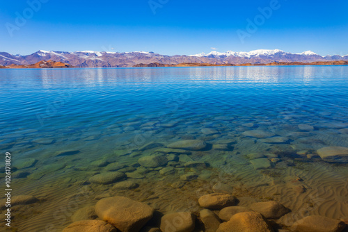 Karakul lake in the Pamir Mountains in Tajikistan photo