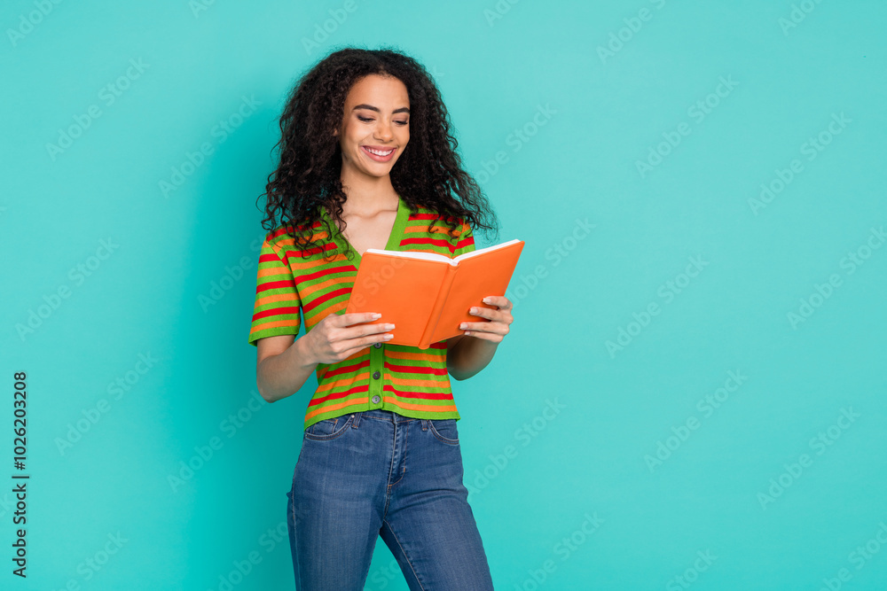 Photo portrait of attractive young woman read book dressed stylish striped clothes isolated on aquamarine color background Photo portrait of attractive young woman read book dressed stylish striped clothes isolated on aquamarine color background