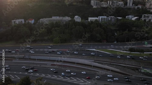 Time lapse of busy freeway/ highway road junction in Perth metropolis city center during sunset . Transportation and infrastructure concept . Western Australia photo