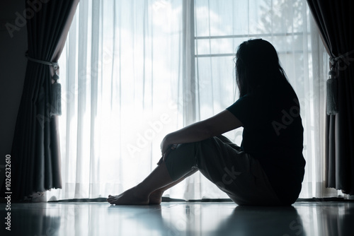 young woman sat alone, feeling weight of anxiety, stress, and depression, her sadness echoing struggles many people face in silence. anxiety, stress, depression, woman, person, sad, adult, alone. photo