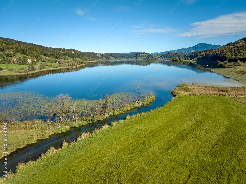 Aerial landscape in the Allgaeu Alps with lake Alpsee next to Immenstadt, Bavaria, Germany Aerial landscape in the Allgaeu Alps with lake Alpsee next to Immenstadt, Bavaria, Germany