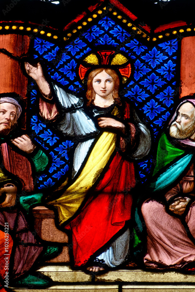 2024-08-02, Paris, FRANCE. Stained glass (19th century) of The young Jesus in the Temple among the Doctors of the Law. 2024-08-02, Paris, FRANCE. Stained glass (19th century) of The young Jesus in the Temple among the Doctors of the Law.