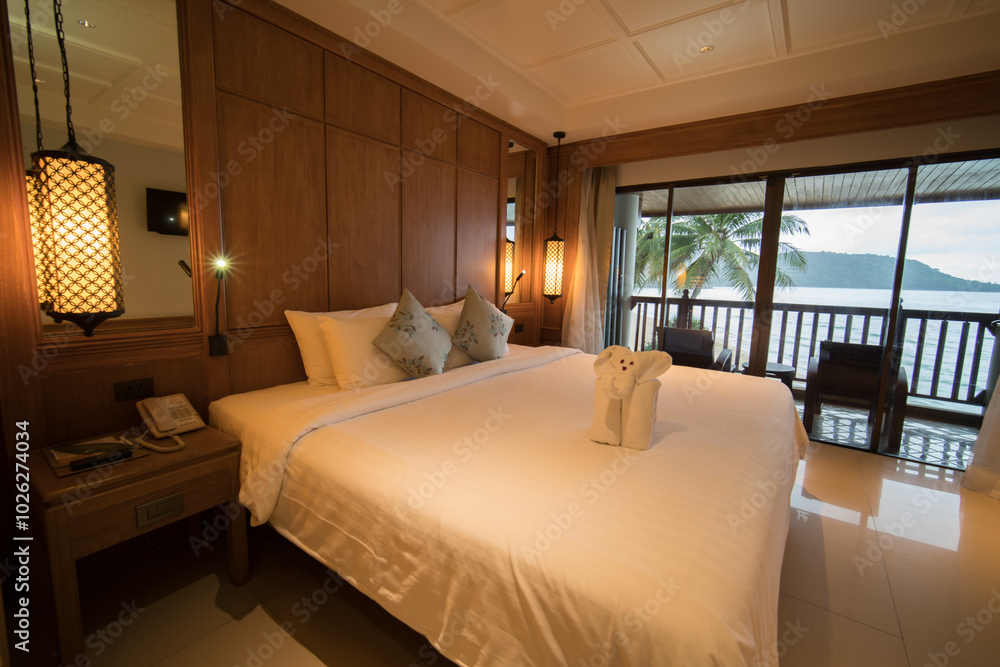 Interior of modern bedroom at hotel with white bed and pillow. Interior of modern bedroom at hotel with white bed and pillow.