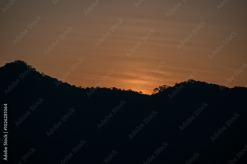 Obraz premium landscape view of sunset above mountain with colorful sky
