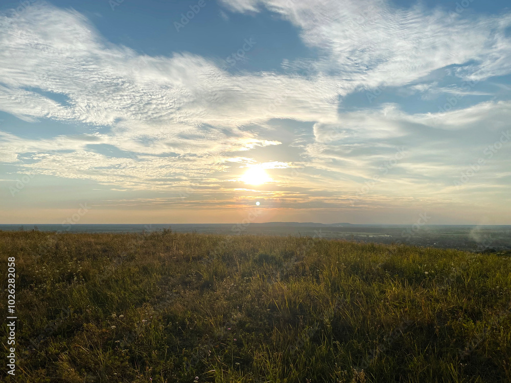 Obraz premium sunset over the field