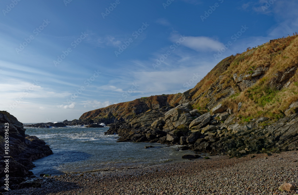The Entrance and gently shelving Shingle Beach of Old Portlethen Fishing Harbour on the Aberdeenshire Coast of Scotland. The Entrance and gently shelving Shingle Beach of Old Portlethen Fishing Harbour on the Aberdeenshire Coast of Scotland.