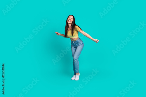 Full body portrait of nice young woman dancing wear top isolated on turquoise color background