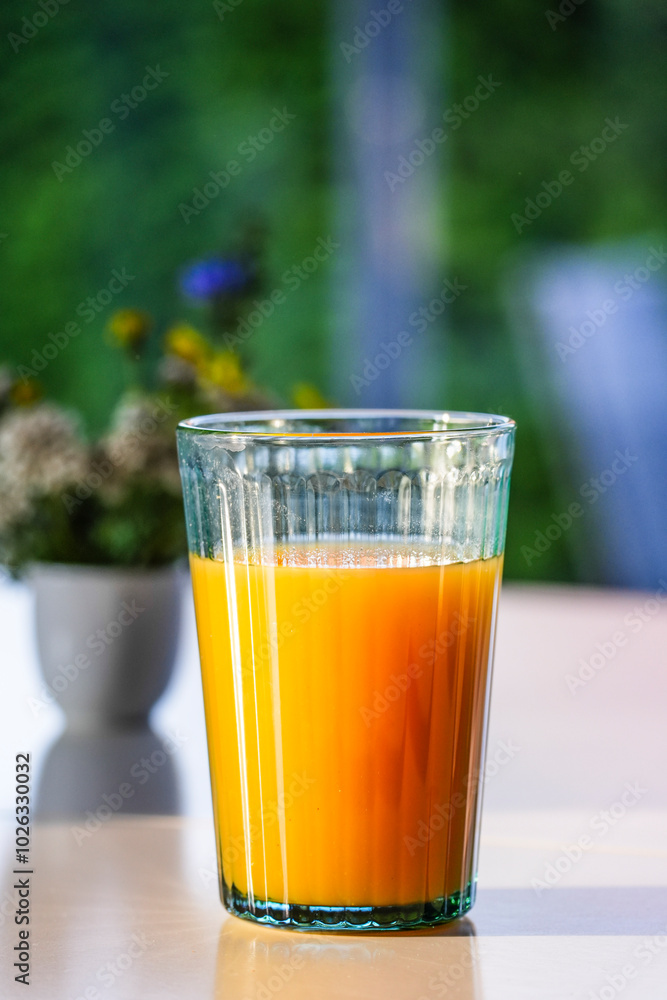Fruit juice on the breakfast table in the morning sunlight Fruit juice on the breakfast table in the morning sunlight