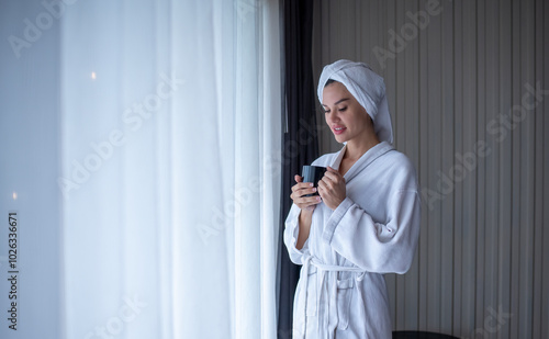 Картината върху платно Happiness young woman in a bathrobe is smiling and feeling fresh after the showe