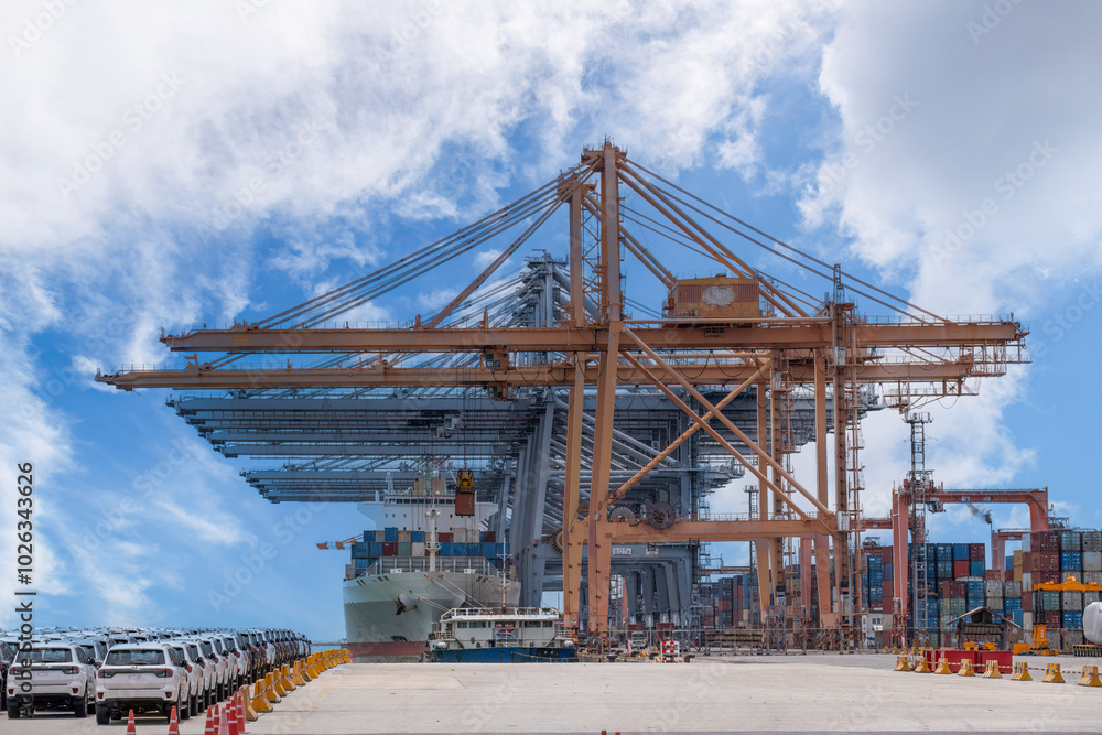 Logistics container dock cargo yard with working crane bridge in shipyard with transport logistic import export background. Logistics container dock cargo yard with working crane bridge in shipyard with transport logistic import export background.