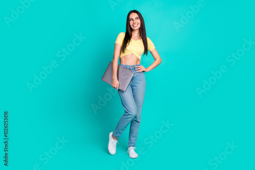 Full body portrait of nice young woman laptop look empty space wear top isolated on turquoise color background