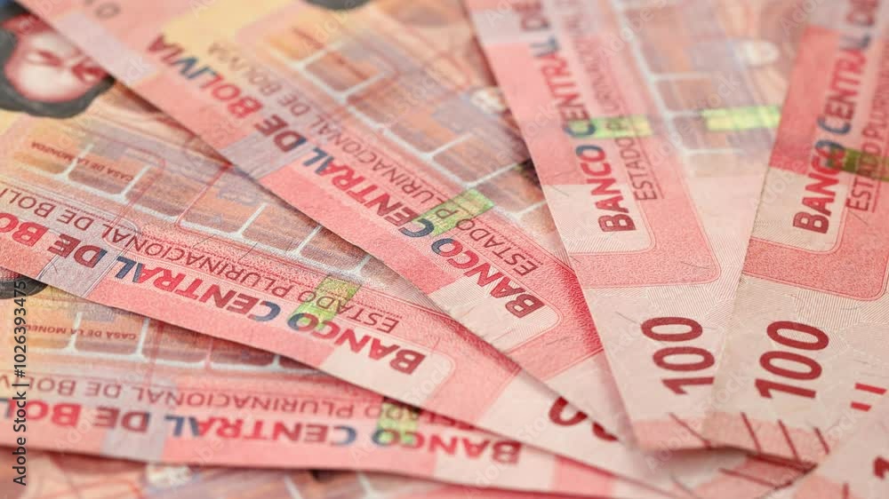 Bolivian money rotating, Lot of 100 bolivianos banknotes, Concept of financial success, lottery or big win. Bolivia monetary, Financial concept