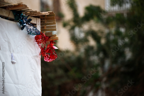 Jewish holiday Sukkot in Israel. Fragment of decoration of Traditional Sukkah on the street. photo