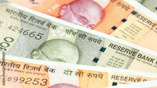 Indian money rotating, Lot of 200 and 500 Indian rupees banknotes, Concept of financial success, lottery or big win. India cash