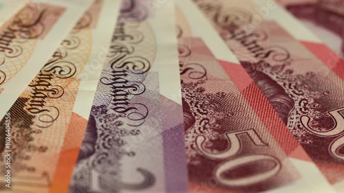 UK money rotating, Lot of united Kingdom pounds. Britain currency, Financial concept, close up