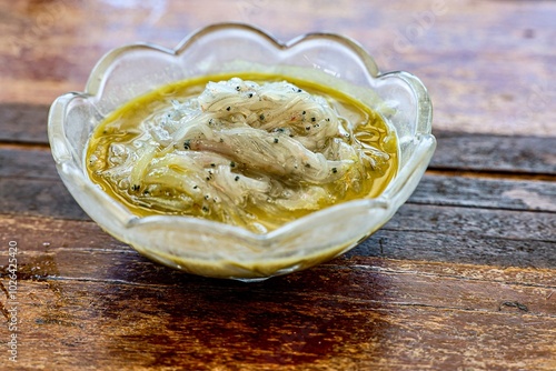 Εκτύπωση καμβά Fresh whitebait in a glass bowl with marinade