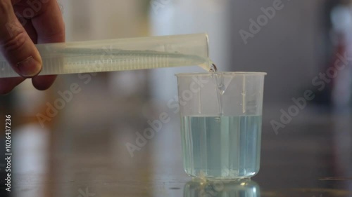 Improving laboratory safety. Improving laboratory safety. Using plastic beaker and cylinder, replacing glass in a chemistry laboratory. 