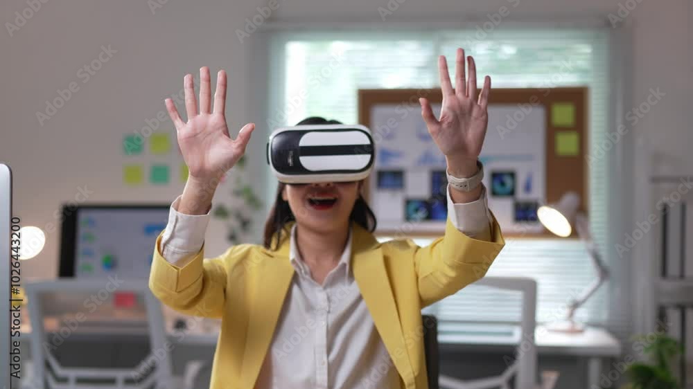 Businesswoman gesturing while wearing a virtual reality headset in a bright office setting, showcasing modern technology and innovation Businesswoman gesturing while wearing a virtual reality headset in a bright office setting, showcasing modern technology and innovation