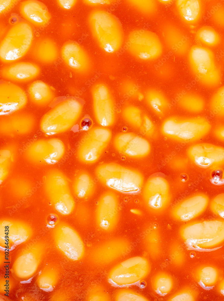 Baked beans in tomato sauce,close up top view,warmed and ready to serve. Baked beans in tomato sauce,close up top view,warmed and ready to serve.