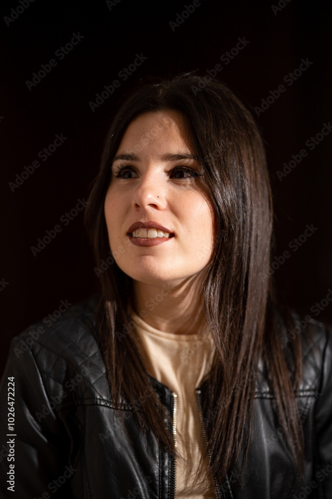 Portrait of a young woman with make-up on a dark background Portrait of a young woman with make-up on a dark background