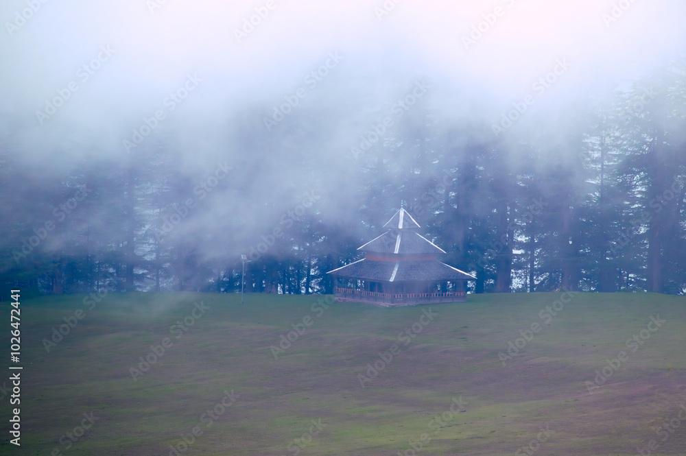 Fototapeta premium It's a misty morning. Pundarik Rishi Temple, Upper Neahi village, Sainj Valley, Eco Zone, Great Himalayan National Park, Himachal Pradesh, India. 