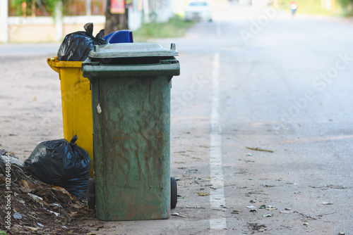 Plastic bins filled with trash and debris in public places