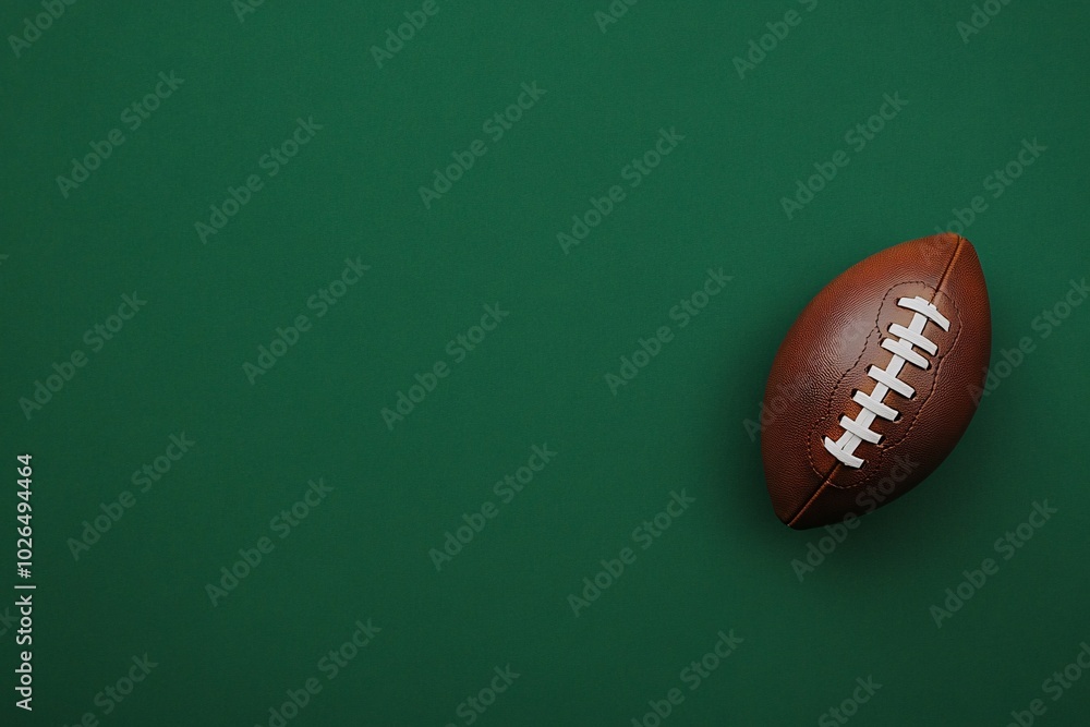 A football is on a green background A football is on a green background
