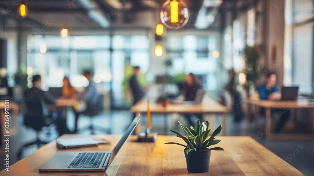 Blurred view of a modern office meeting room with people working on laptops, creating a professional and focused atmosphere Blurred view of a modern office meeting room with people working on laptops, creating a professional and focused atmosphere