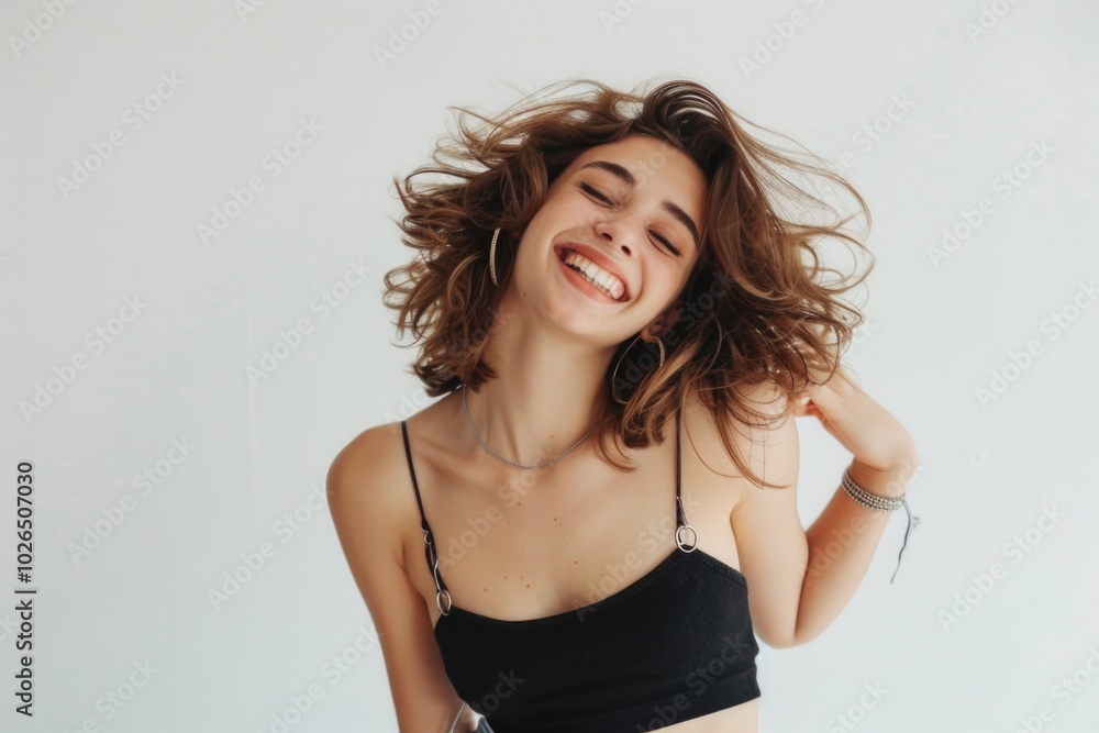 A woman with a bright smile wearing a black bra top A woman with a bright smile wearing a black bra top