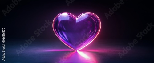 Glowing heart shape illuminated against a dark background creating a romantic...