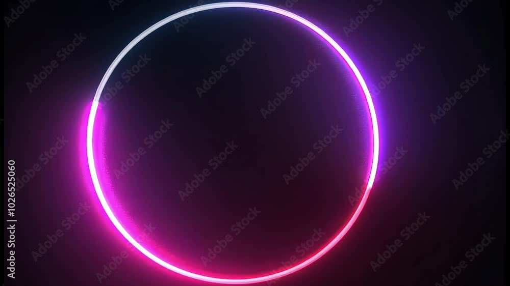 A bright pink and blue neon circle glowing on a dark background. A bright pink and blue neon circle glowing on a dark background.