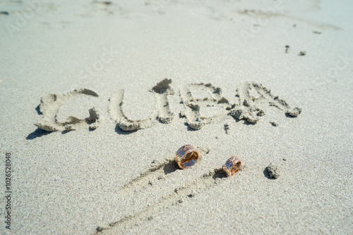 Wedding rings on the sand, bride and groom, rings, wedding rings,  decoration, outdoor ceremony in Cuba, writing on the sand, letters, latin letters photo