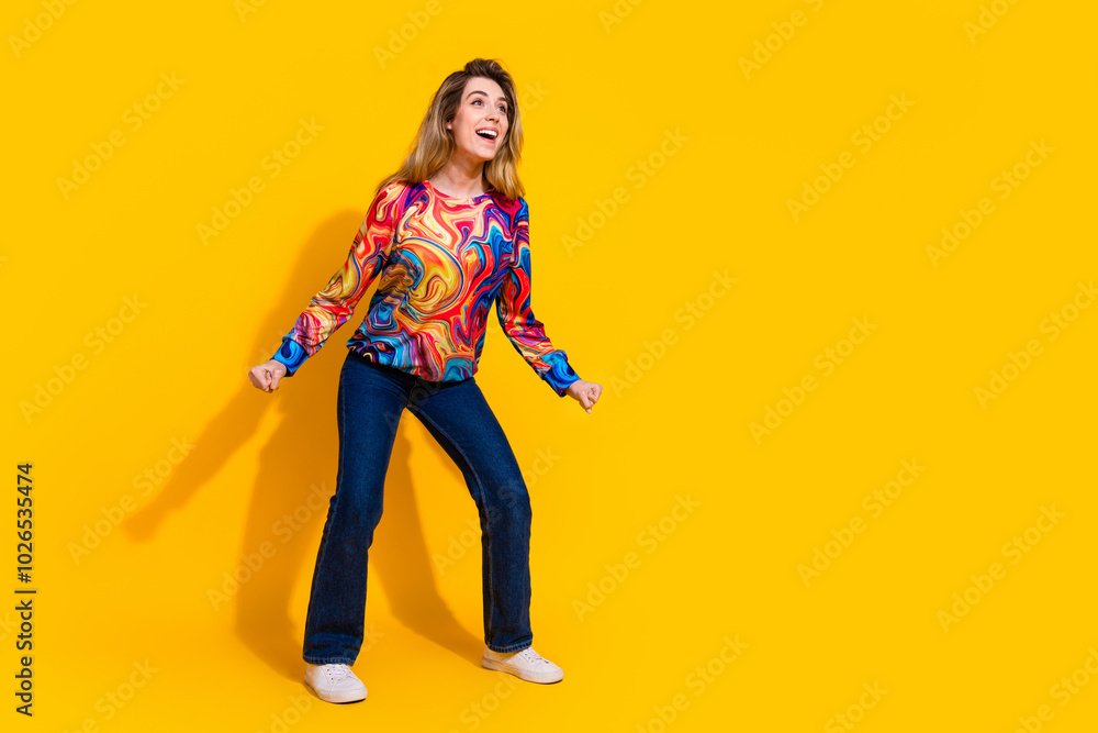 Photo portrait of young funny blonde hair adorable woman wearing casual style outfit clubbing isolated on yellow color background Photo portrait of young funny blonde hair adorable woman wearing casual style outfit clubbing isolated on yellow color background