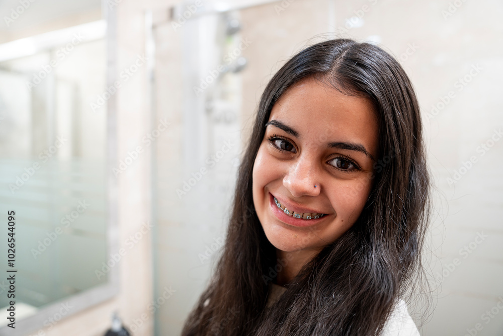 Bright smile: teenage girl with braces showing her teeth Bright smile: teenage girl with braces showing her teeth