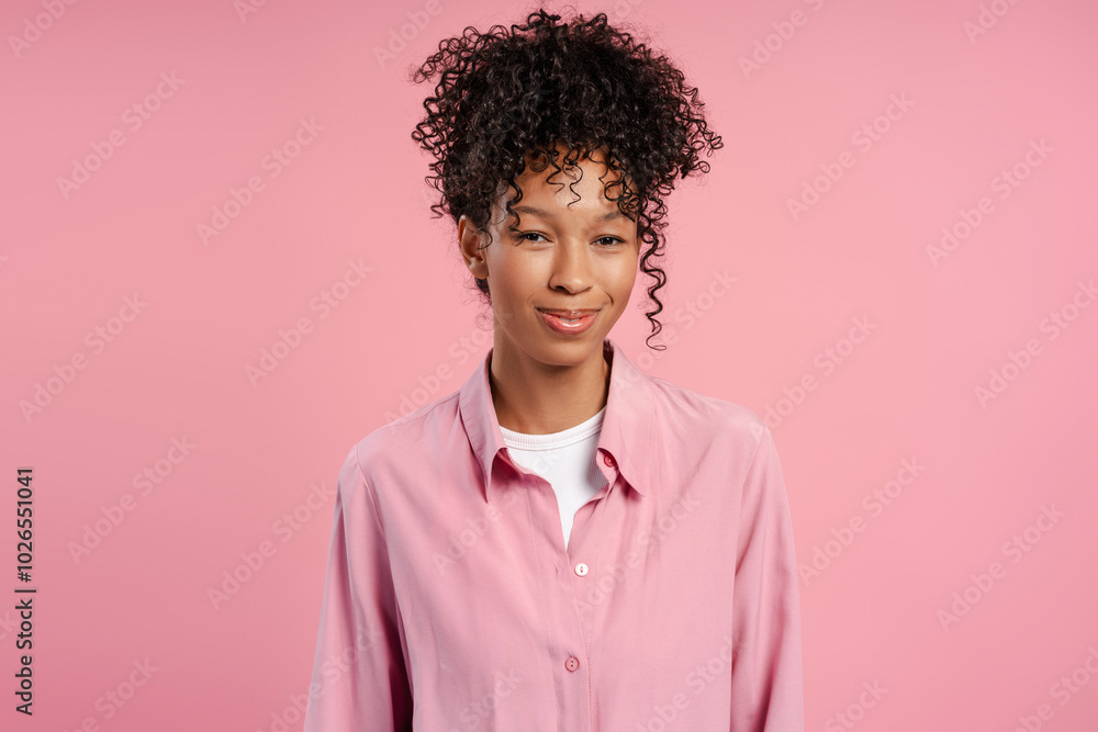 Portrait of emotional African American woman smiling and looking at camera isolated Portrait of emotional African American woman smiling and looking at camera isolated