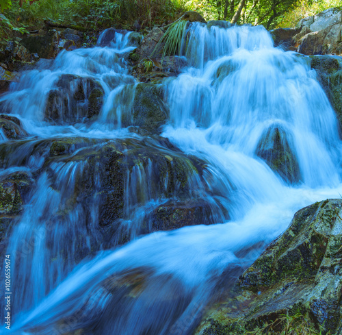 Autumn in Aitzondo erreka. Waterfall at Aitzondo erreka in the Aiako Harriak Natural Park, Euskadi photo