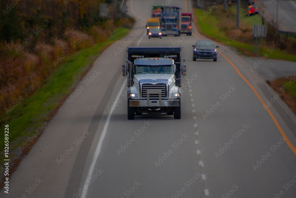 Heavy truck on a Canadian highway in the fall in Quebec