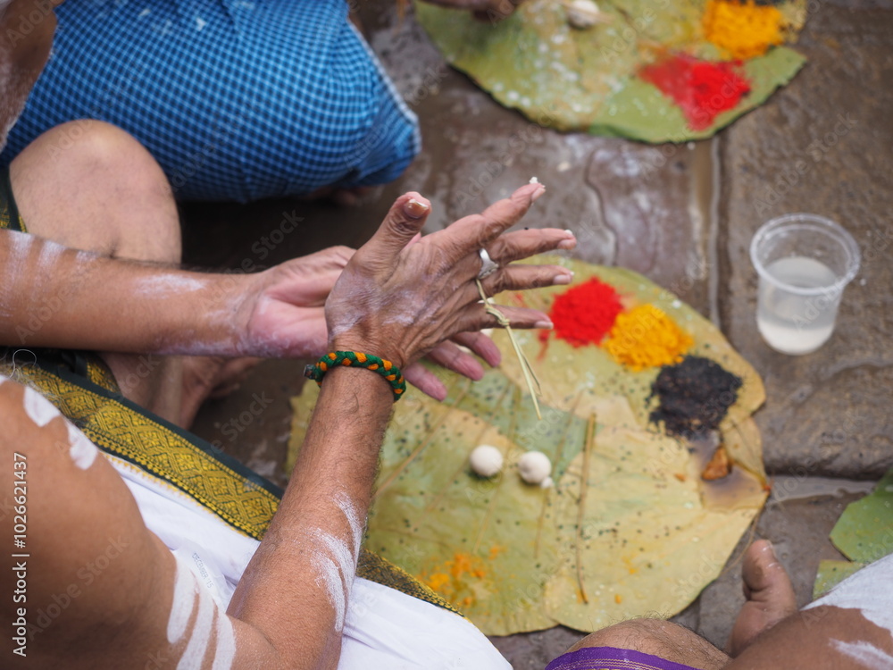 Close up of man hands doing puja ritual in Varanasi, India Close up of man hands doing puja ritual in Varanasi, India