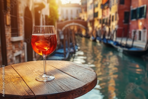 Fototapeta Naklejka Na Ścianę i Meble -  Alcoholic cocktail with ice cubes on table of venice sidewalk cafe