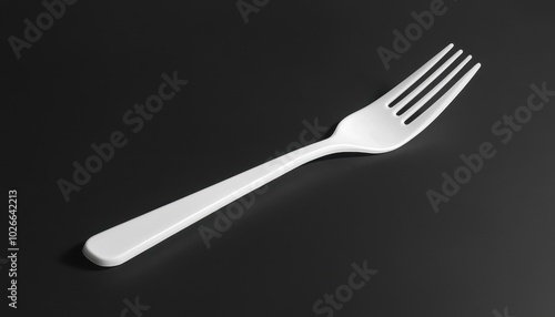 Plastic fork mockup on a black background for simple and disposable dining solutions