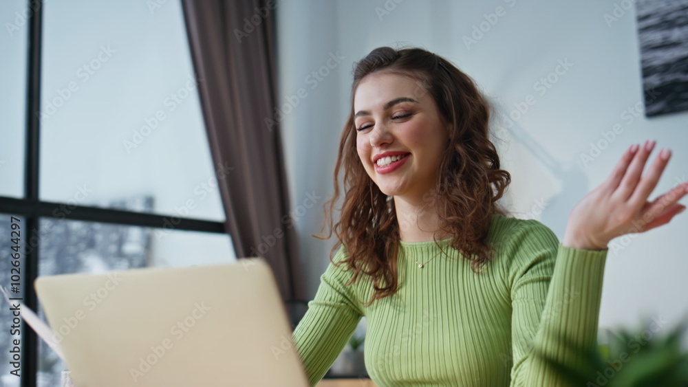Positive girl studying online talking laptop desk closeup. Woman video calling Positive girl studying online talking laptop desk closeup. Woman video calling