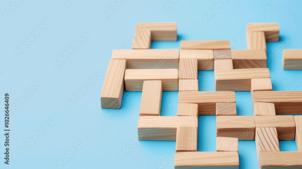 Wooden maze on blue surface, representing the complexities of business challenges and the pathways to effective solutions, engaging visual metaphor for strategic thinking Wooden maze on blue surface, representing the complexities of business challenges and the pathways to effective solutions, engaging visual metaphor for strategic thinking