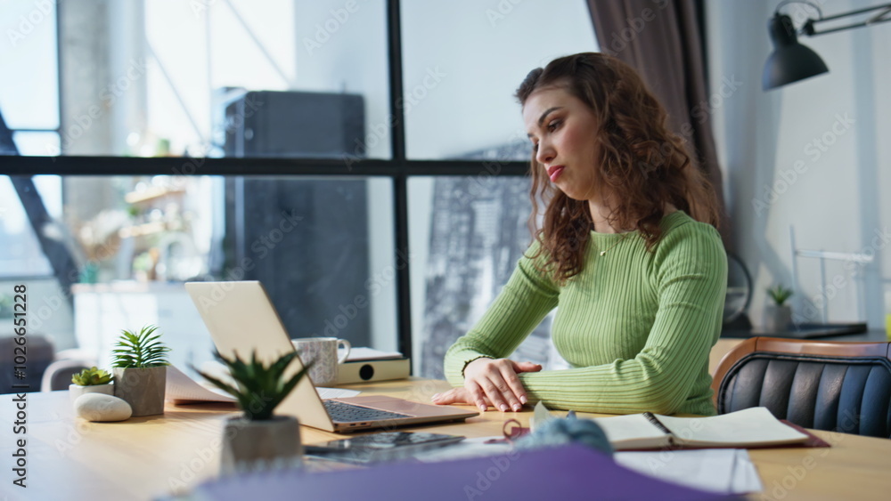 Sales manager talking online using laptop office closeup. Woman looking papers Sales manager talking online using laptop office closeup. Woman looking papers