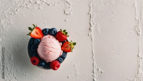 Pink Ice Cream with Fresh Berries on Soft Background. photo