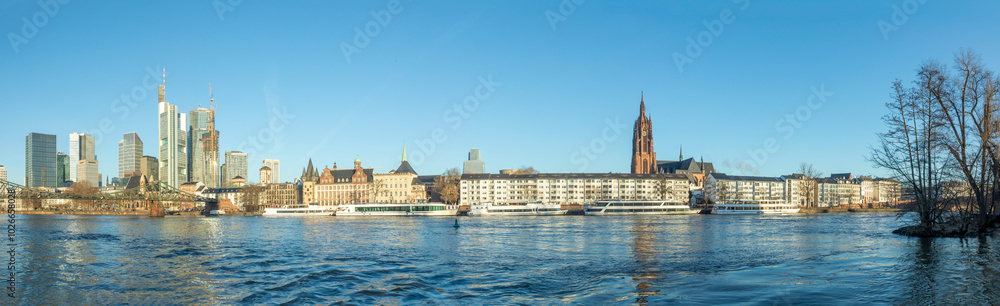 Fototapeta premium scenic skyline of Frankfurt am Main with reflection in the river, Germany