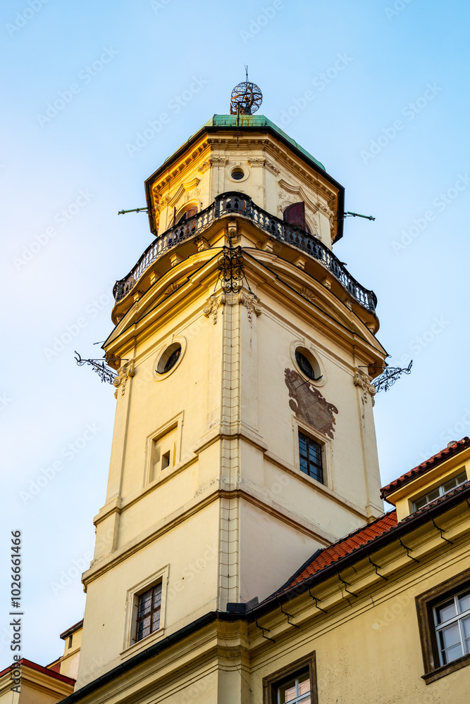 The Klementinum Astronomical Tower rises against a clear sky in Prague, showcasing its architectural beauty and historical significance as a center of astronomical studies. The Klementinum Astronomical Tower rises against a clear sky in Prague, showcasing its architectural beauty and historical significance as a center of astronomical studies.